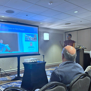 A scientist giving a talk at a conference