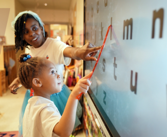 PreK student learning letters