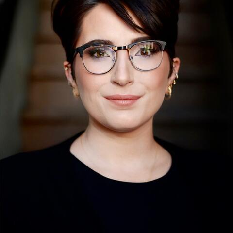 a woman looking at a camera