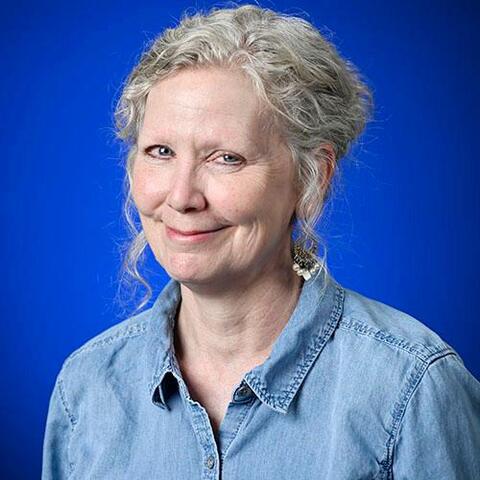 katie mckee formal university portrait with bright blue background