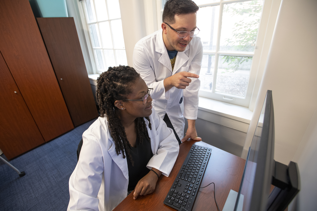 Graduate students reviewing Physiological data